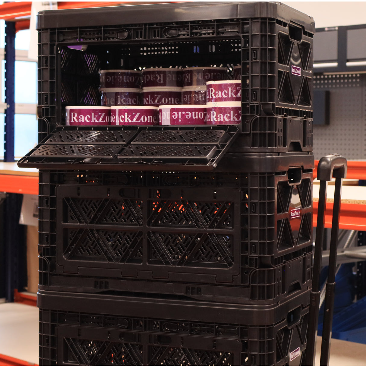 RackZone 48L Foldable Picking Crate Dolly with Handle used in a busy warehouse.