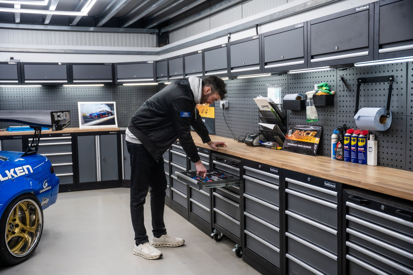 James Deane retrieving a tool from his modular workstation provided by RackZone.ie