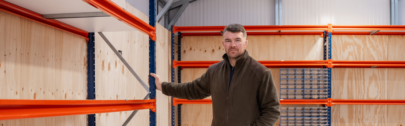 Peter O'Mahony standing in his garage with Longspan shelving from RackZone.ie