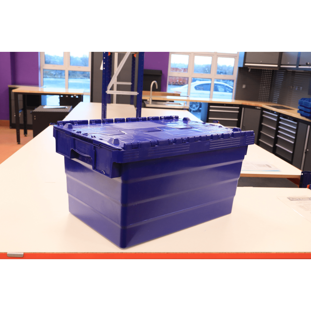 A RackZone 58L Attached Lid Container in blue sits on a white table.