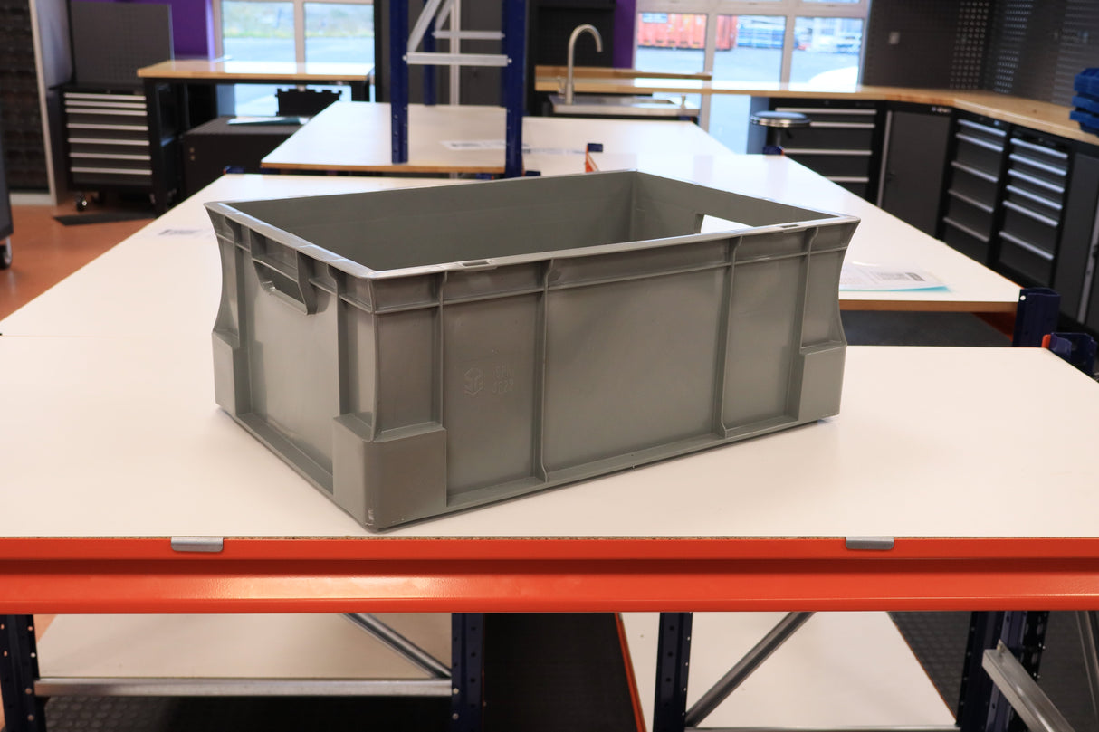 A RackZone Euro Container 600x400x230mm sits on a white table in a workshop.