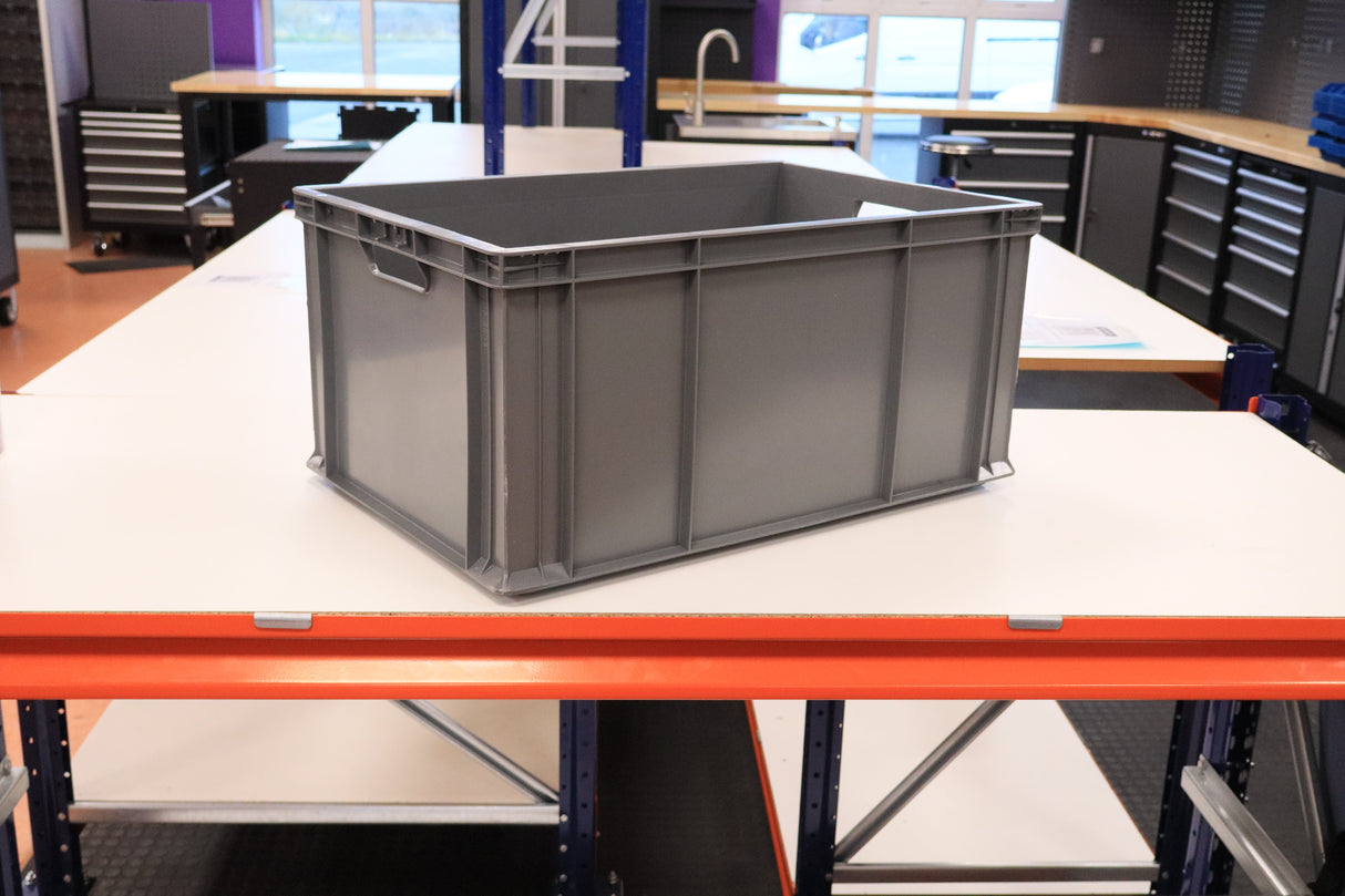 A RackZone Euro Container sits on a white worktable in a workshop.