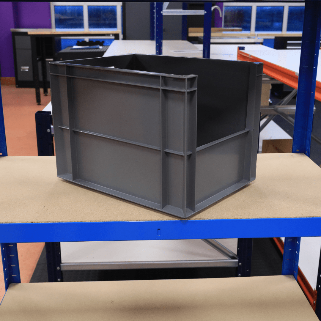 A RackZone Euro Picking Container (400x300x290) Grey is on a workshop shelf.