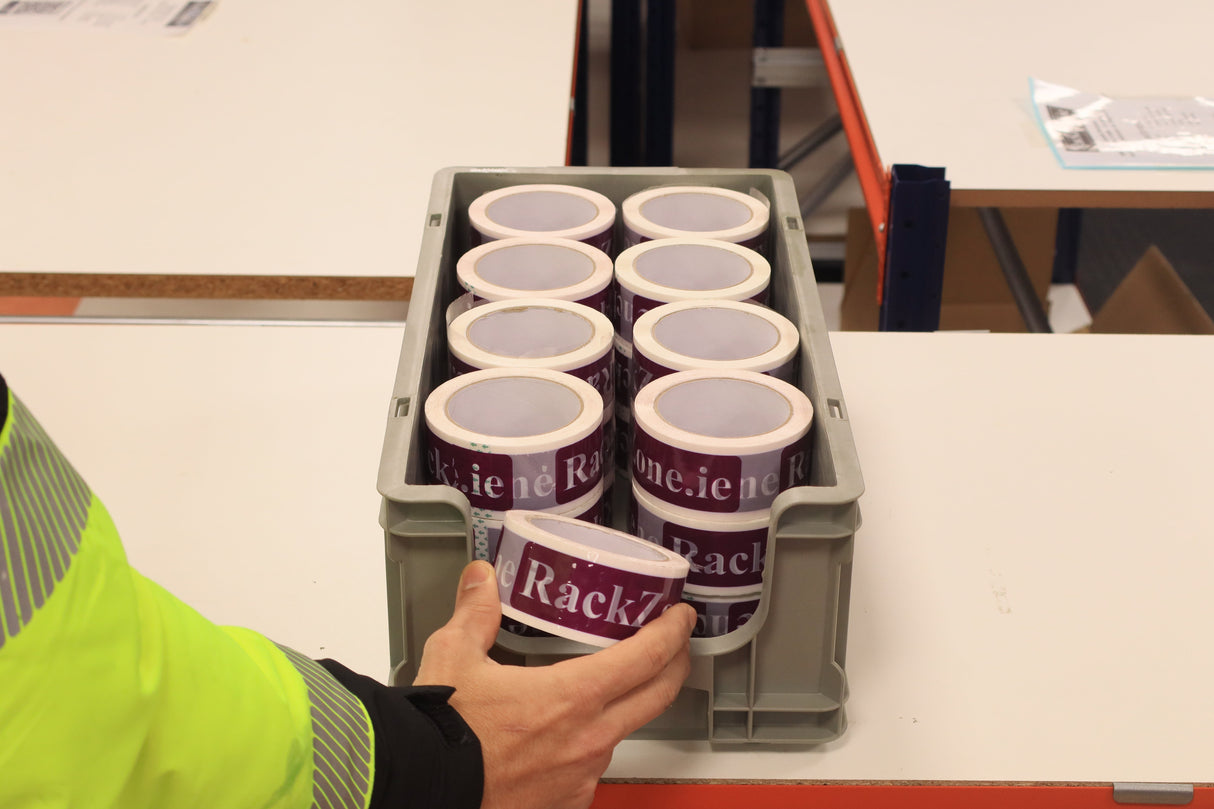 A person puts printed labels into RackZone Euro picking containers (130 pallet deal).