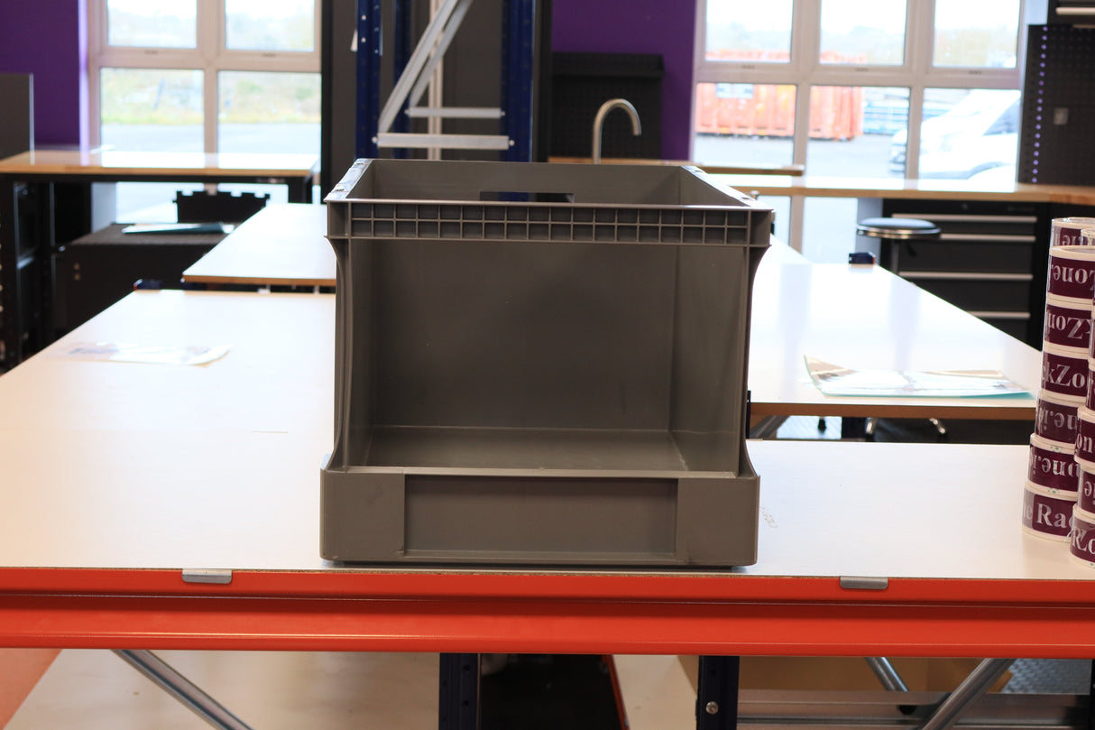 A RackZone Euro Picking Container sits on a white table in a workspace.