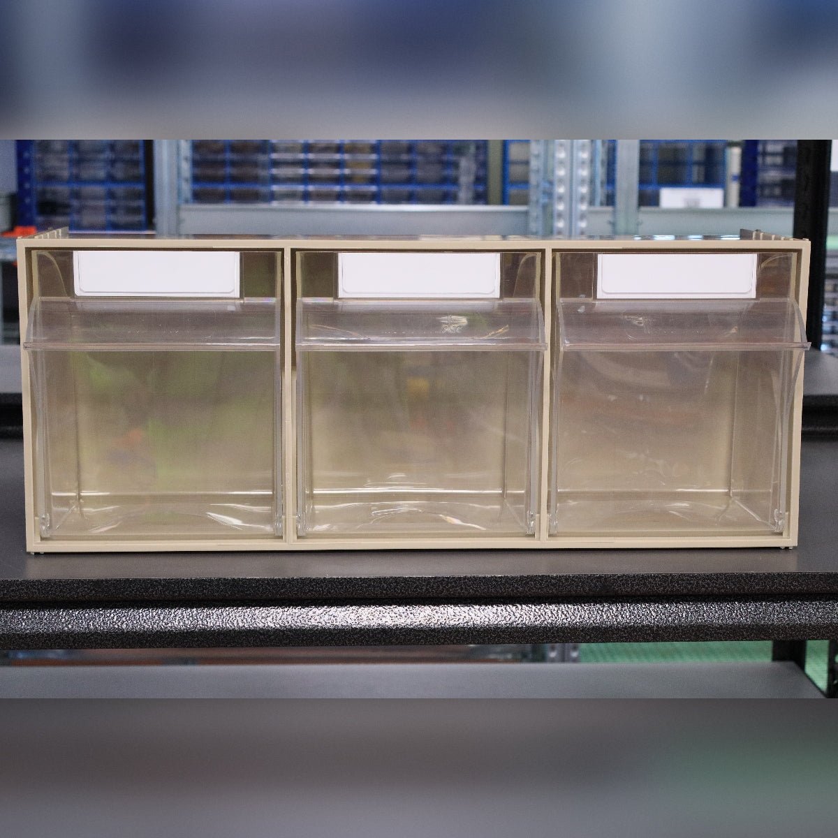 RackZone Storage Tilt Bin Madia 5: 3 clear-front bins with label slots on shelf.