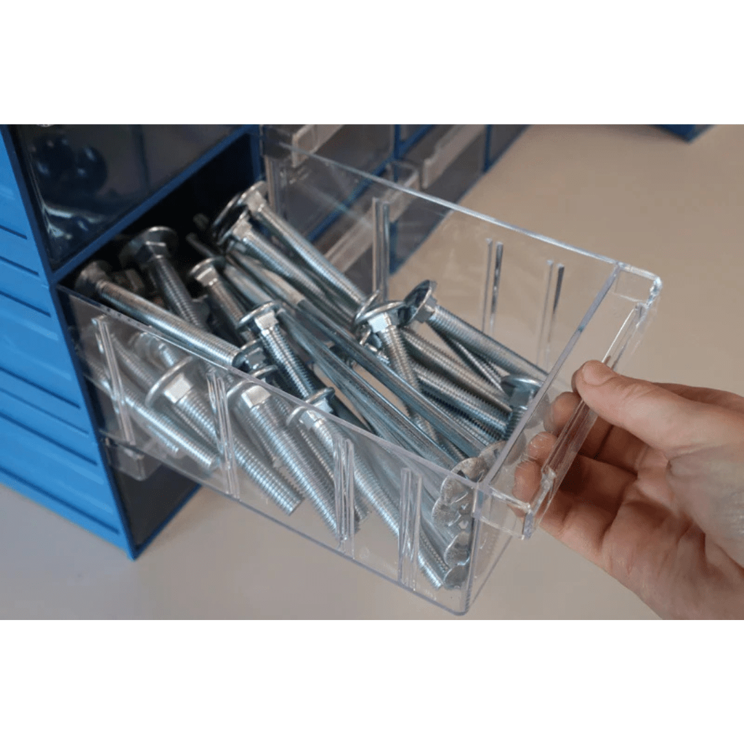 A hand pulls out a RackZone Plastic Drawer 32 Box from a wall storage unit.