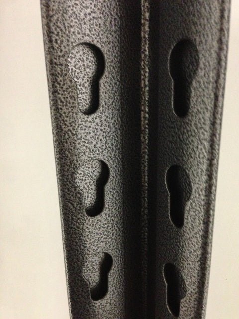 Close-up of RackZone Rivet Shelving bars with keyhole slots in a vertical row.