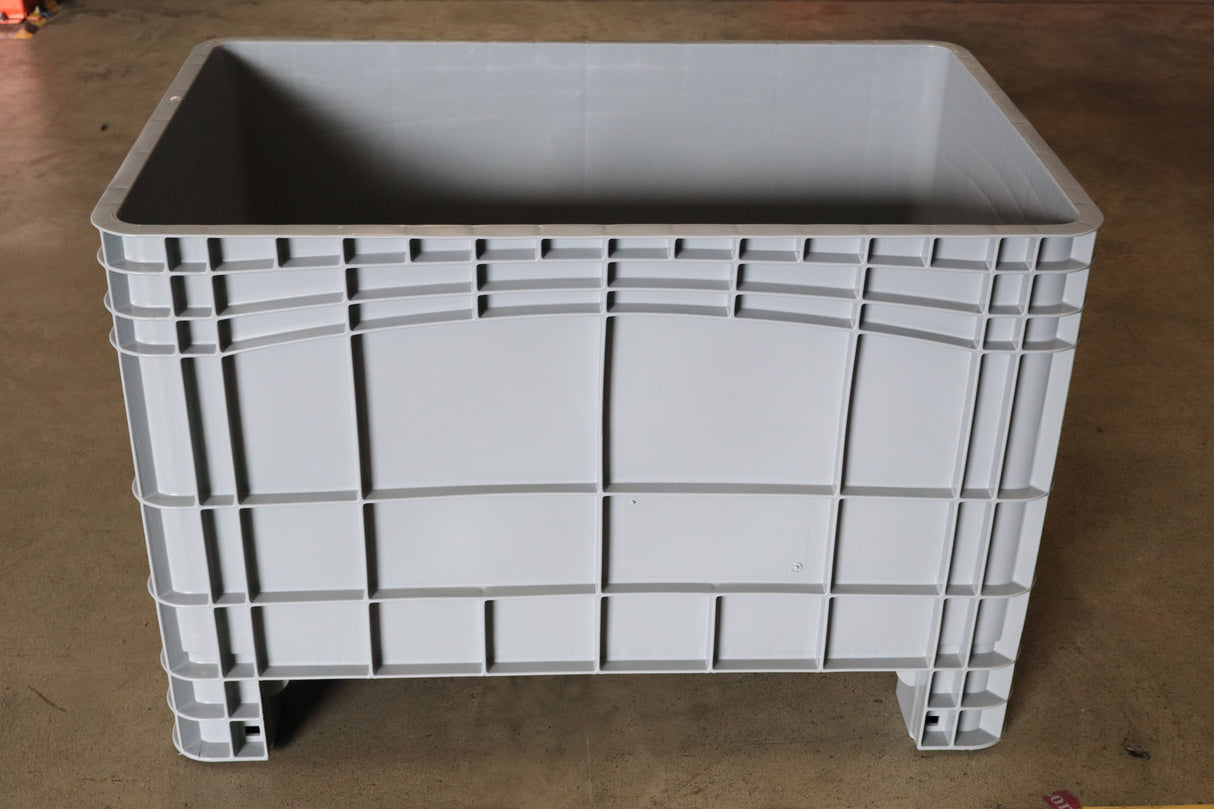 RackZone Stacking Container 984x625x665mm Grey on a concrete floor.