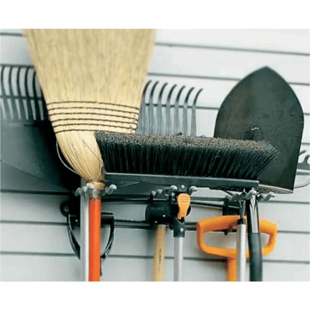 Garden tools and brooms hang neatly on the RackZone Slatwall Big Tool Rack.