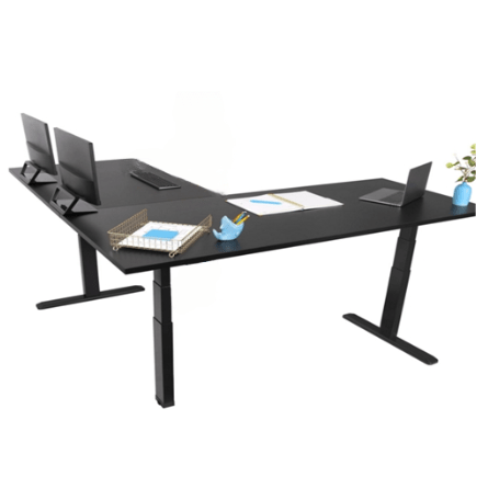 RackZone L-Shaped Sit-Stand Desk with computers, stationery, and a plant.