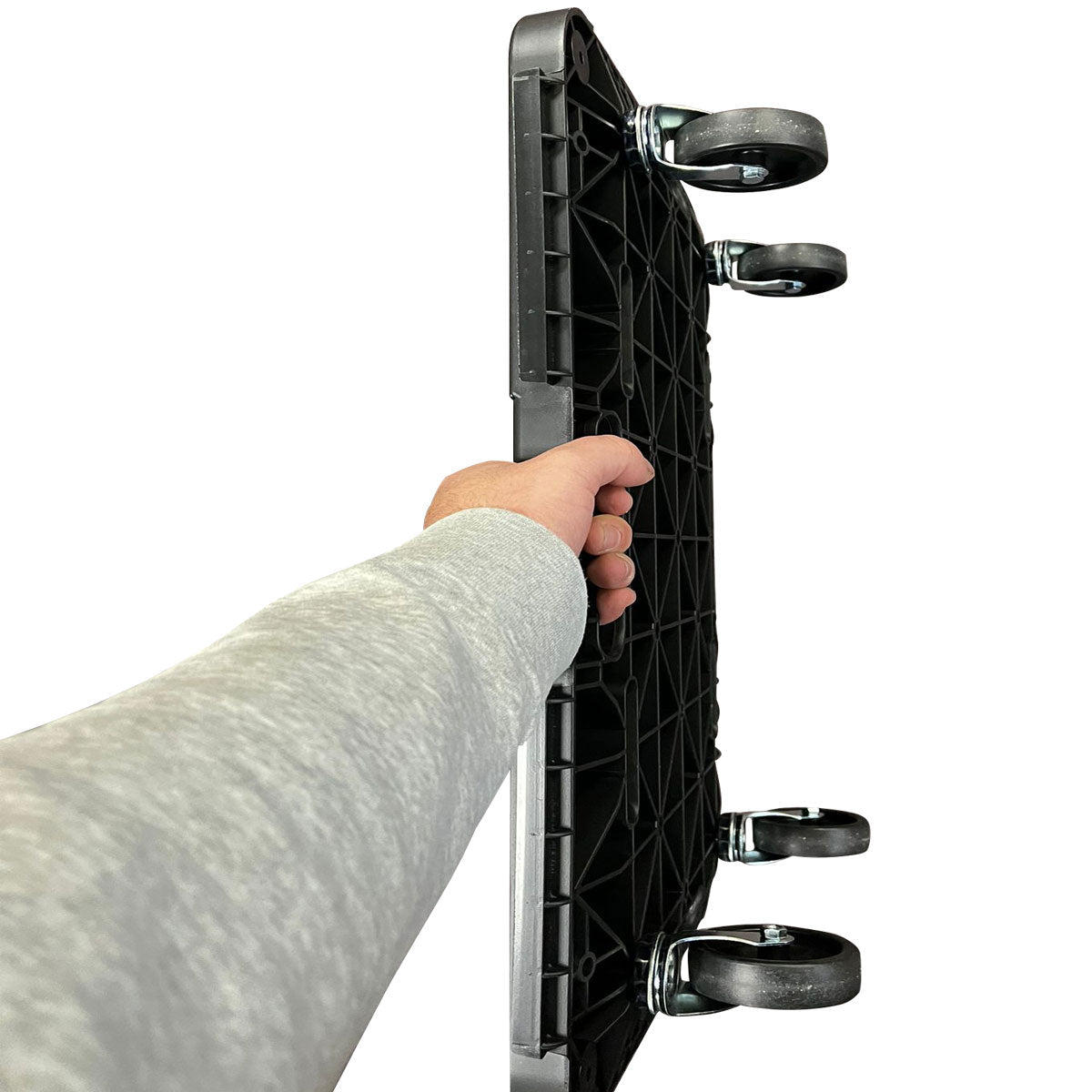 Top view: Person holding RackZone Plastic Dolly 120h x 600w x 400d upright by side.