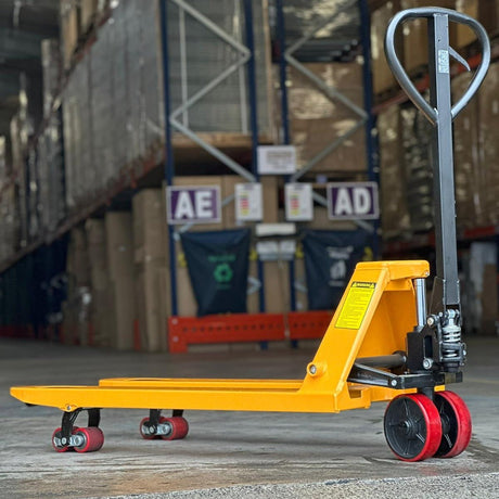 A blue manual pallet jack with a black handle and two front wheels, designed for lifting and moving pallets.