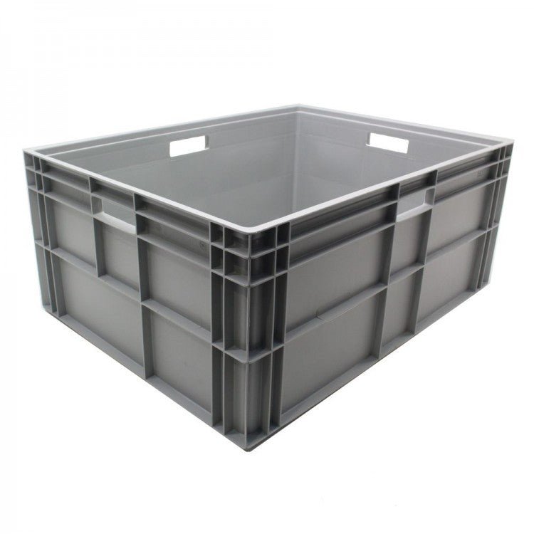 A large, empty gray plastic storage crate with reinforced sides and two rectangular hand grips.