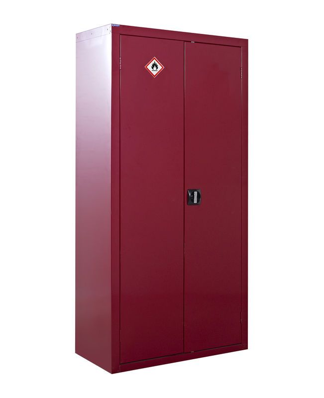 A tall, closed, red metal cabinet with a hazardous flammable materials warning sign on the front doors and a black handle in the center.