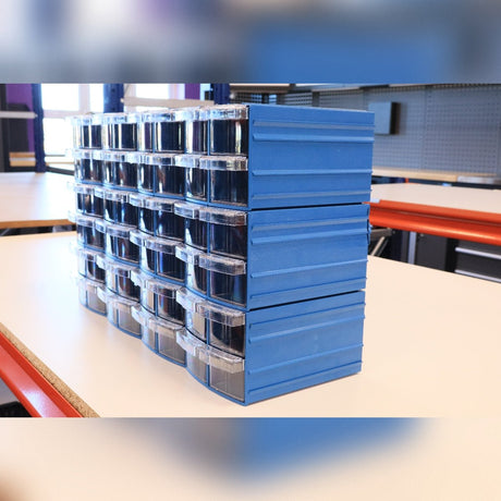 Shelves filled with clear plastic drawers containing various sorted LEGO pieces in different shapes, sizes, and colors.