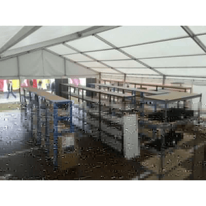 RackZone Value Shelving 5 Bay units installed under a large white event tent.