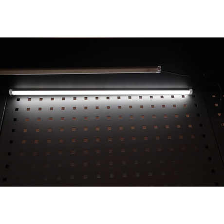 A RackZone Modular Workstation LED Light Set glows above the perforated surface.