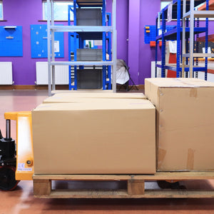 Three large boxes on a pallet, ready for RackZone 2500kg PU Pallet Truck.