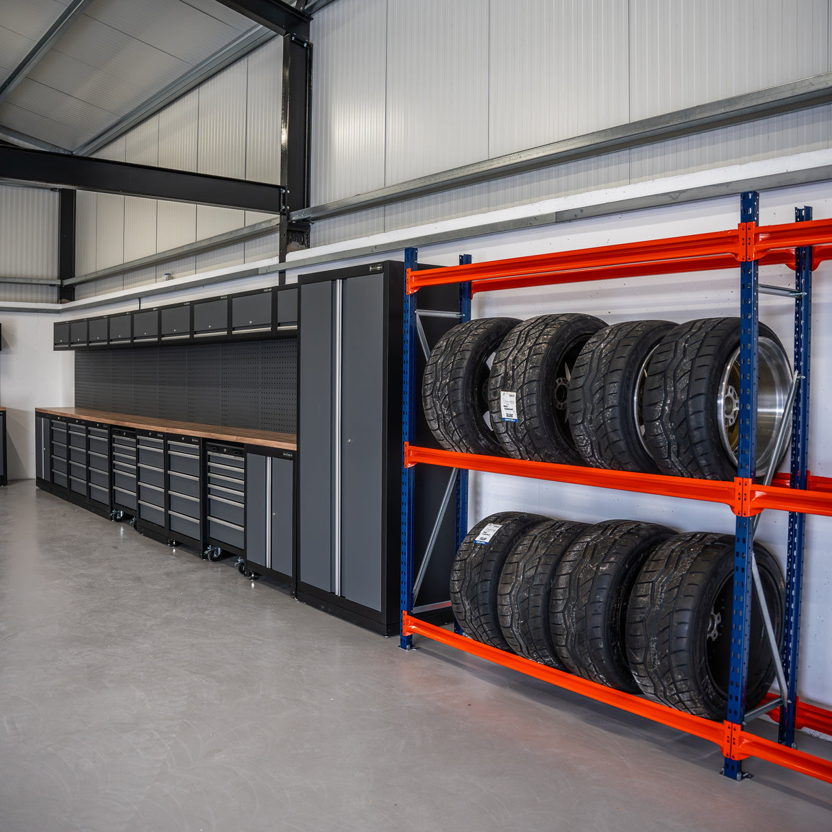 RackZone Tyre Racking 400mm Depth holds tires neatly beside garage tool cabinets.
