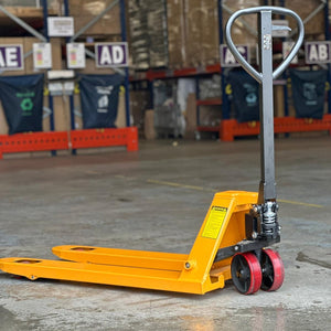 RackZone Pallet Truck 2500kg, PU Wheels, 1150x550mm on warehouse floor.
