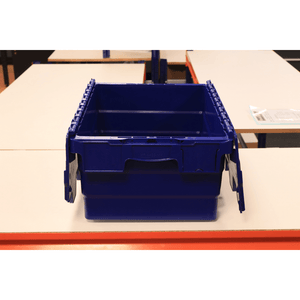 A RackZone 33L blue attached lid container sits open on a white table.