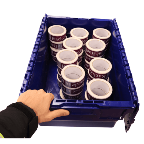A hand holds a RackZone 44L blue attached lid container with packing tape rolls.