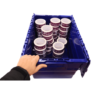 A hand holds a RackZone 58L blue Attached Lid Container filled with tape rolls.