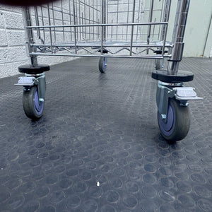 RackZone 4 Tier Chrome plated Trolley with four gray casters on black floor.