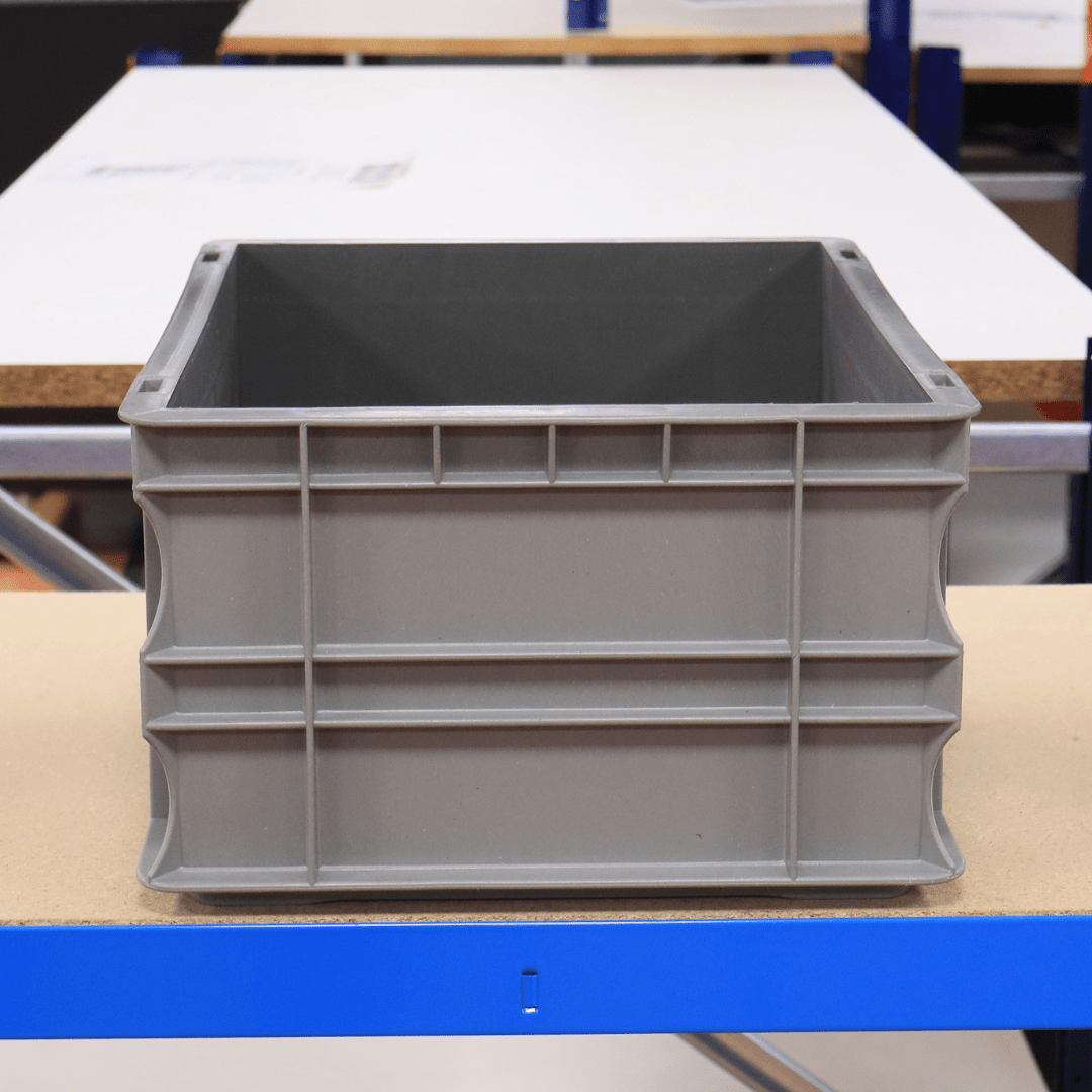 RackZone Euro Container 400x300x175mm on a table in an industrial warehouse.