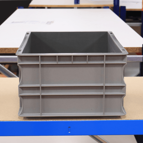 RackZone Euro Container 400x300x175mm on a table in an industrial warehouse.
