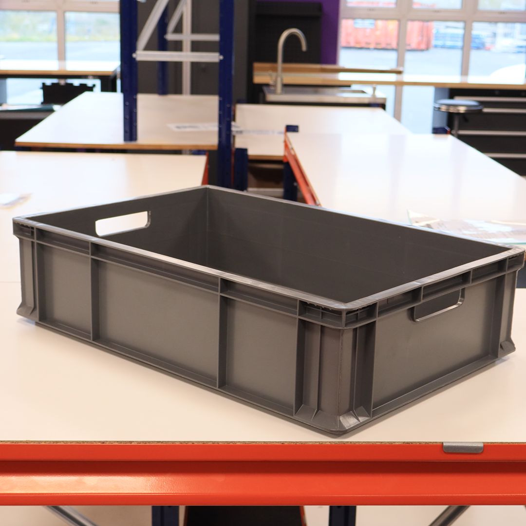 A RackZone grey Euro Container (600x400x150mm) sits on a white table.