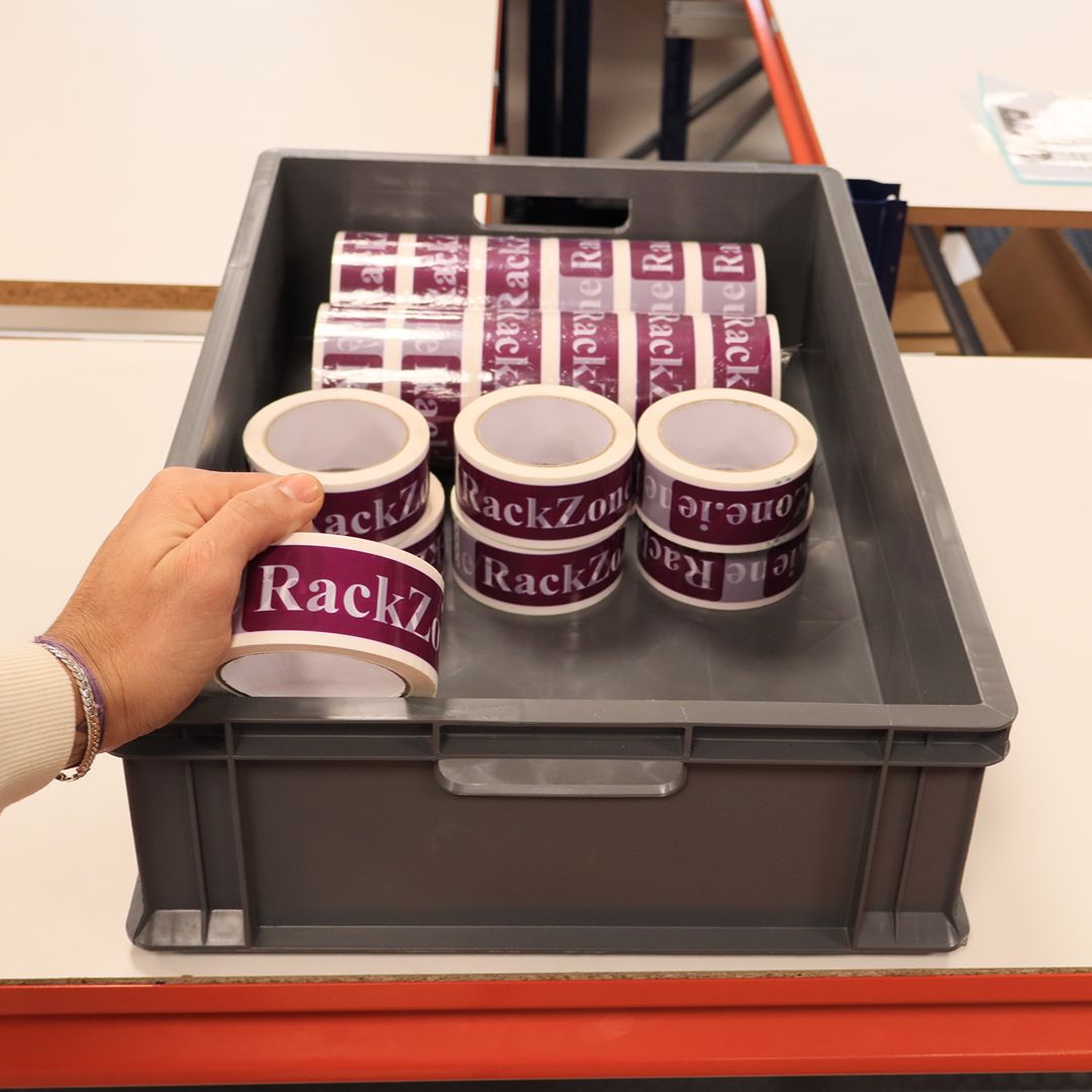 Person holding "RackZone" tape over Pallet Deal - 70 Euro Containers (600x400x150mm).