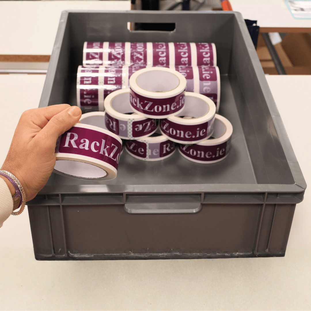 A hand holding a Euro Container 600x400x175mm from RackZone.