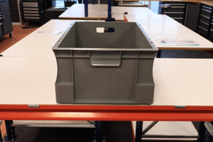 A RackZone Euro Container sits on a white tabletop in a workshop.