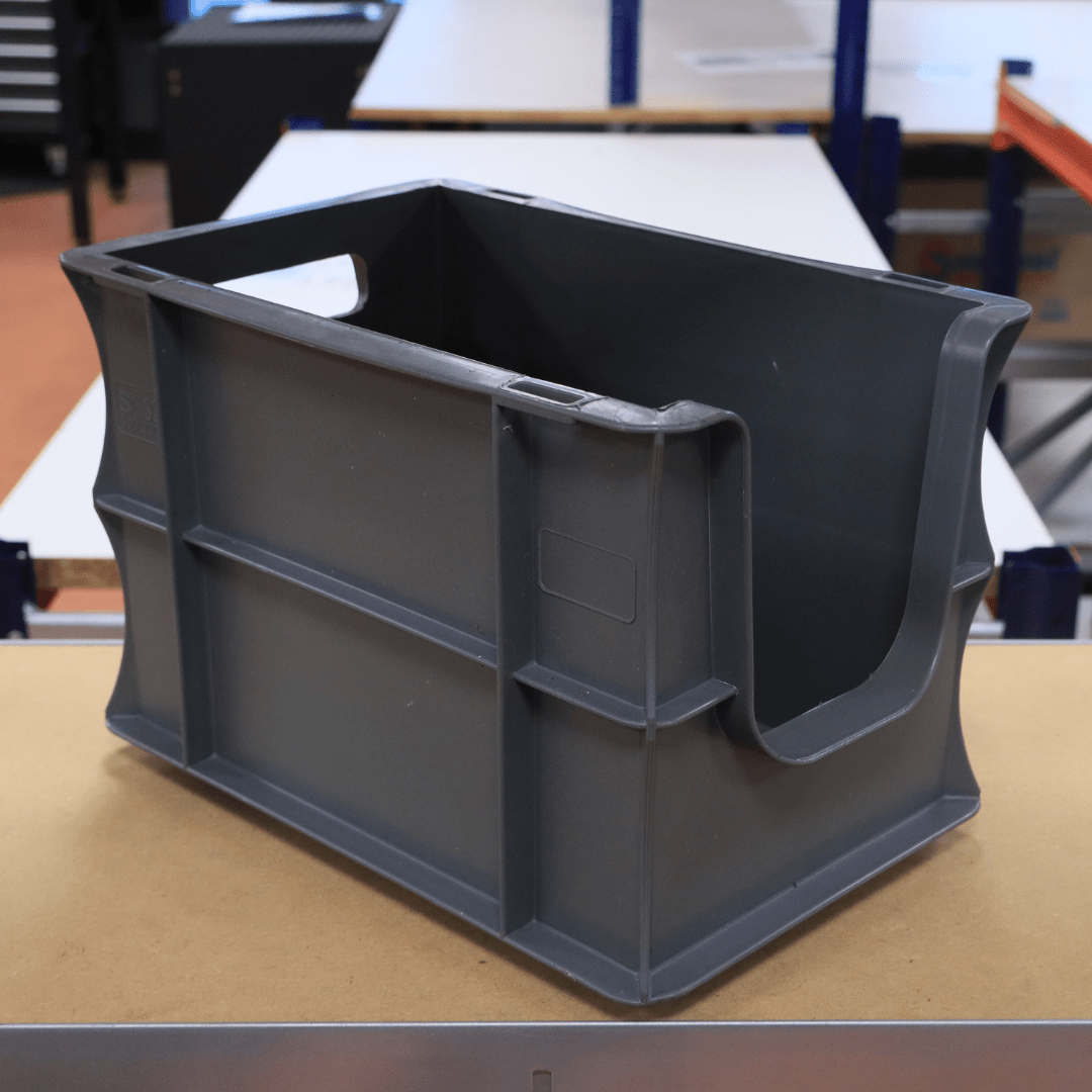 A RackZone Euro Picking Container sits on a workbench.