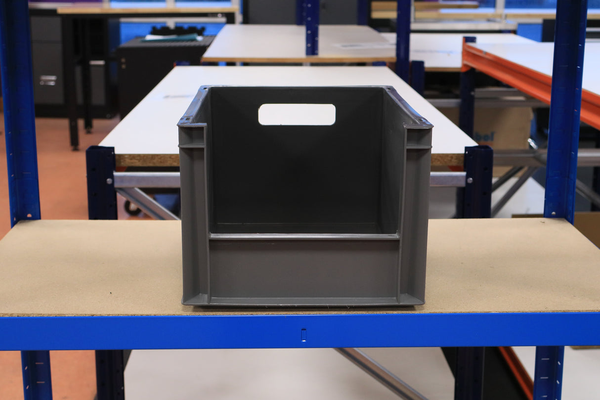 RackZone Euro Picking Container (Grey) on a workbench in an industrial workspace.