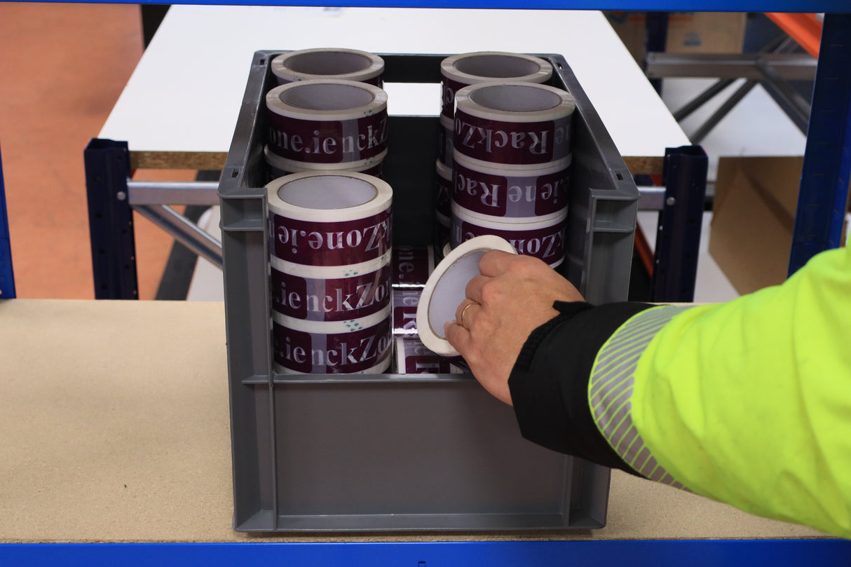 Person lifting tape from a RackZone Euro Picking Container, 400x300x290mm grey.