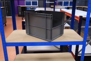 A RackZone grey Euro Picking Container on a blue metal shelf in a workshop.