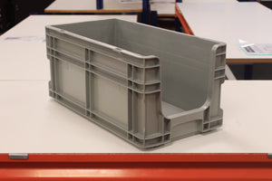 A RackZone Euro Picking Container (grey) sits on a white table.