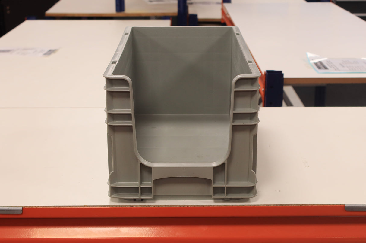 A RackZone grey Euro Picking Container sits on a white table in a bright room.