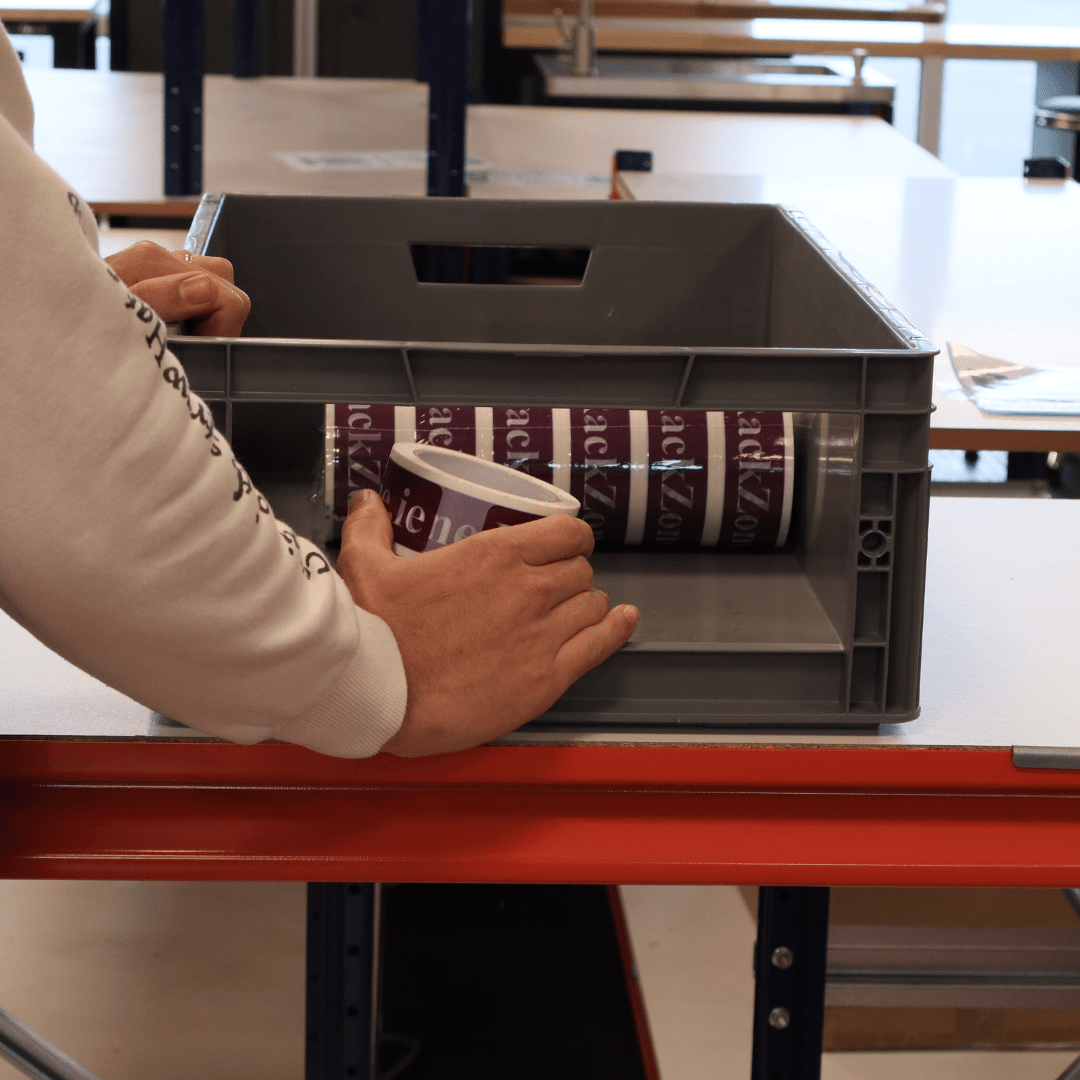 Placing purple labels in a RackZone Euro Picking Container 600x400x200 Grey.