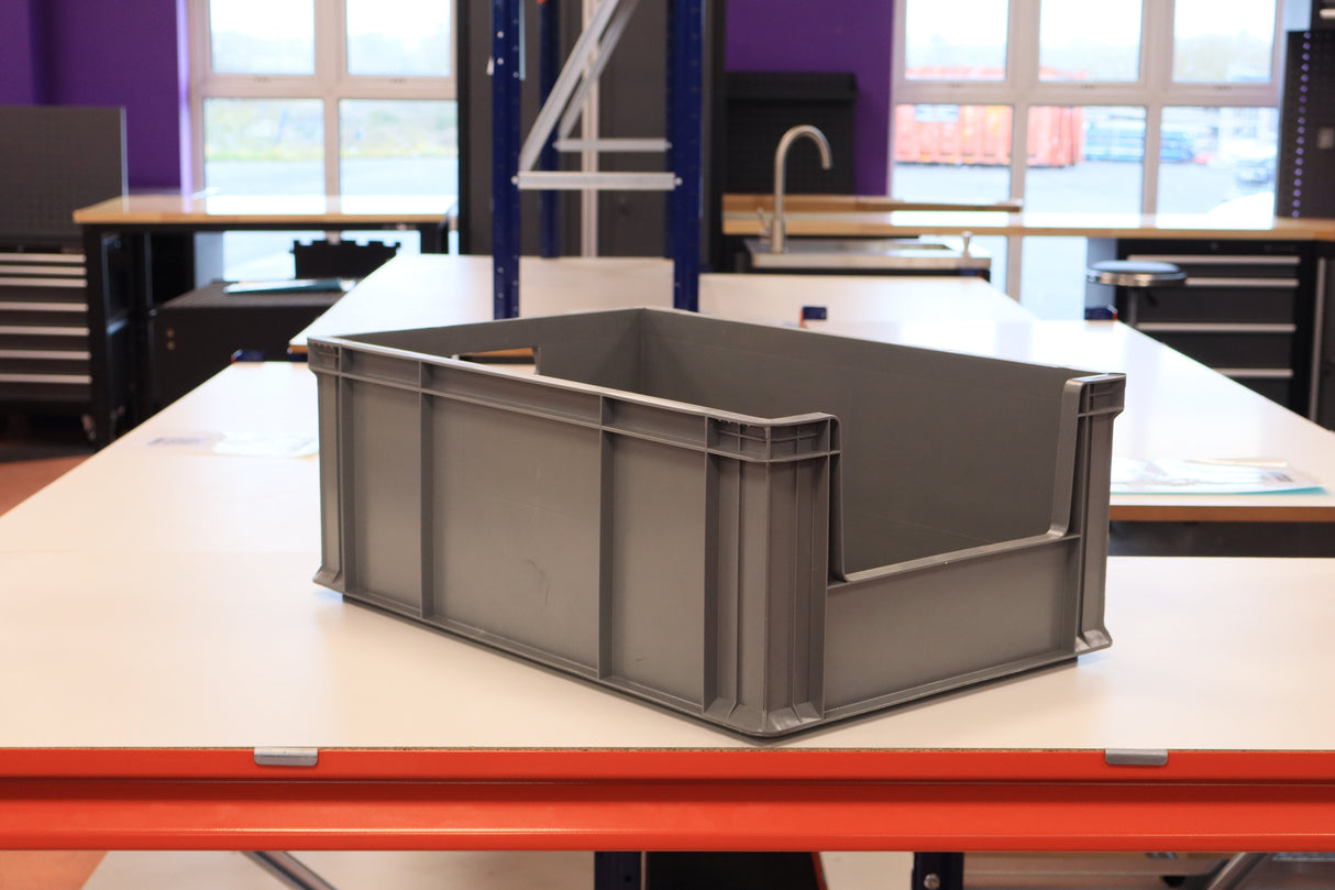 A RackZone 45 Euro Picking Container sits on a white table in a workshop.