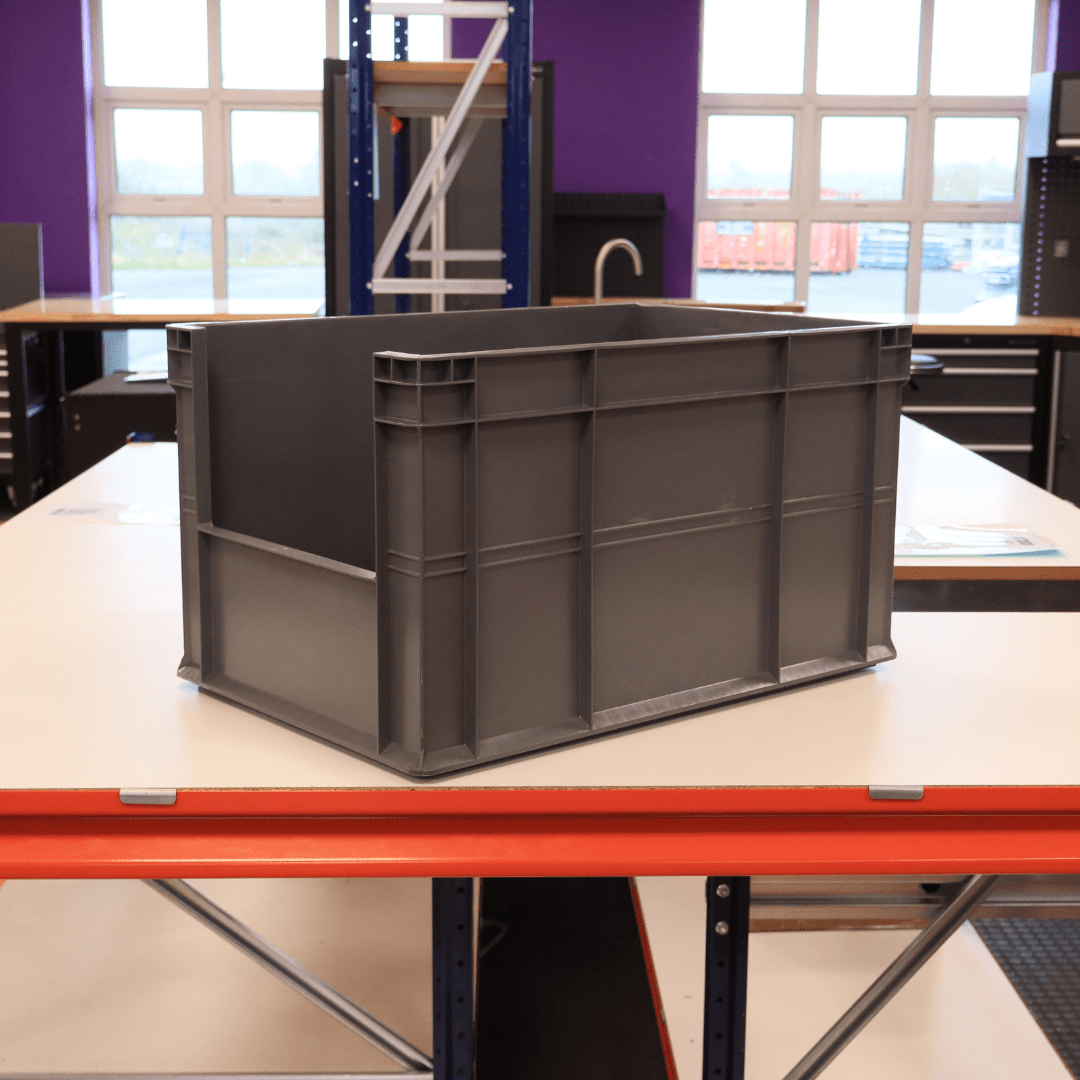 A RackZone Euro Picking Container 600x400x320 grey sits on a table.