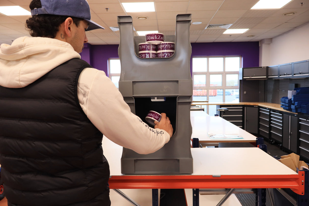Placing a "RAZE" can into a RackZone Euro Picking Container in the workspace.