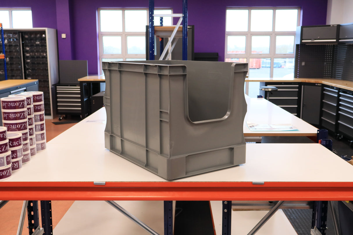 A RackZone Euro Picking Container 600x400x420mm grey is on a workbench.