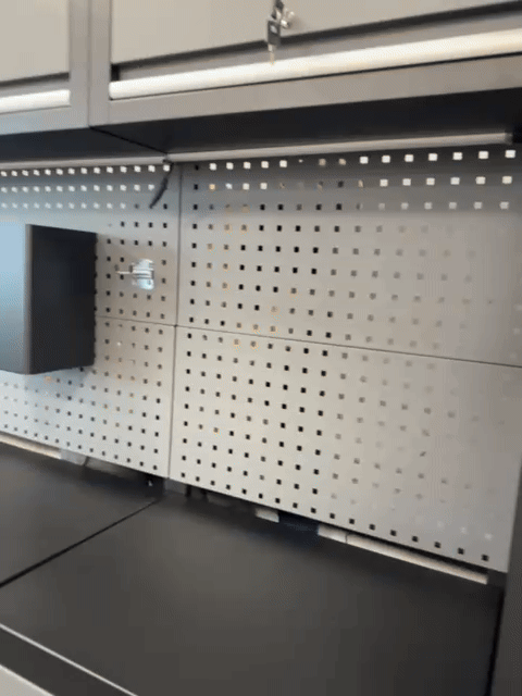 A hand installs a magnetic organizer under RackZone's LED Light Set (3-Pack).