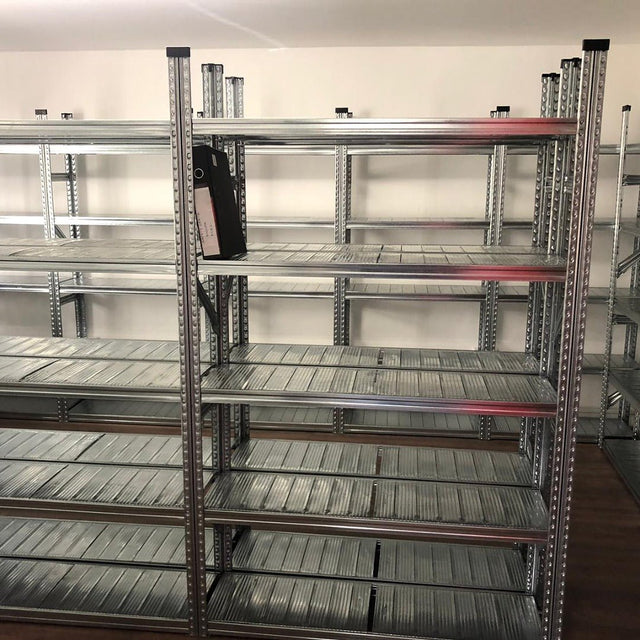 Rows of empty RackZone Galvanised Shelving 400mm with one binder on top.