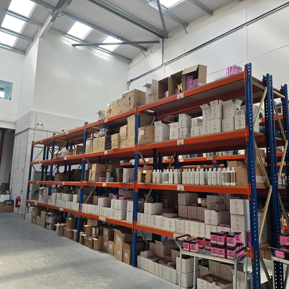 Heavy items arranged sensibly across a warehouse shelf