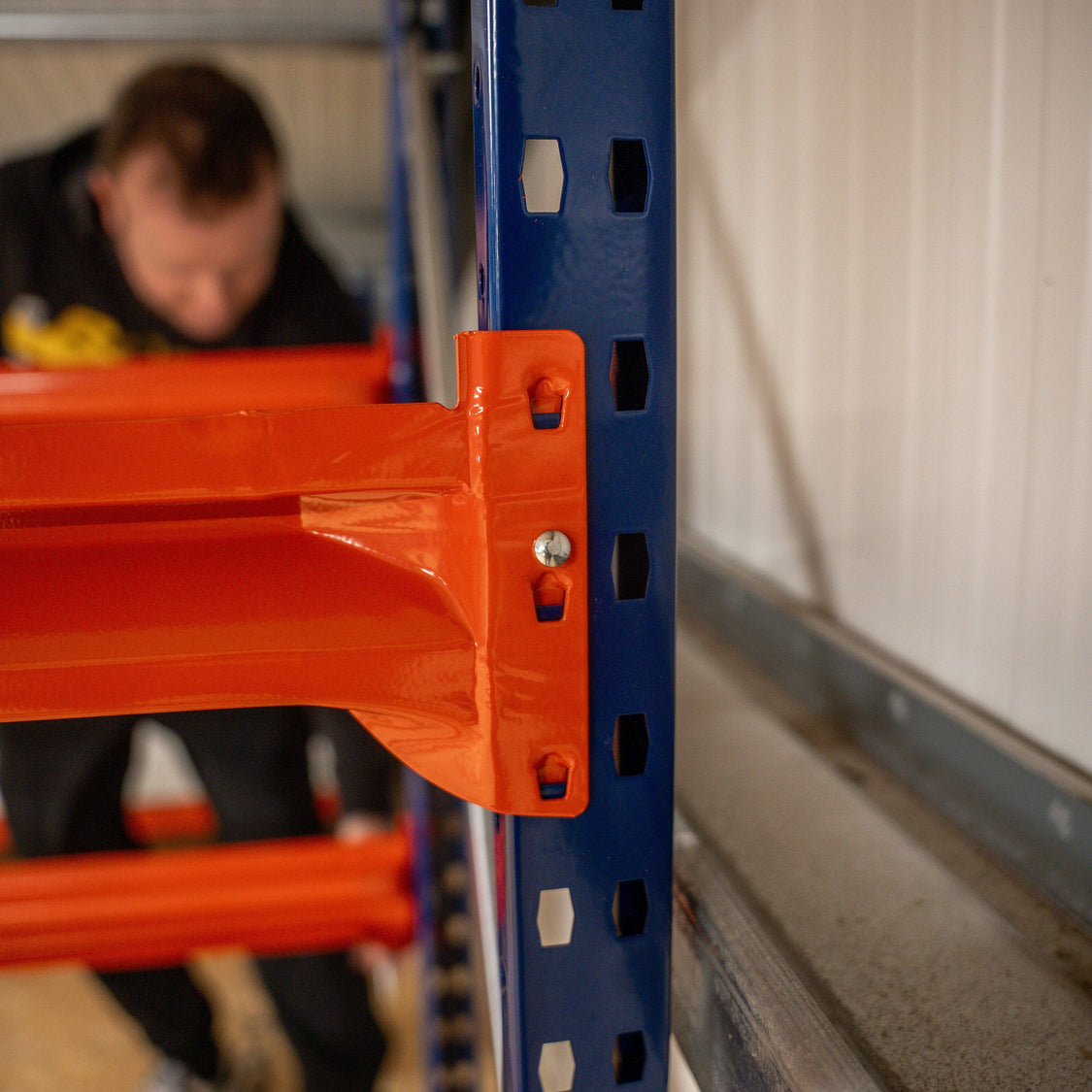 Modular shelving being built out in stages